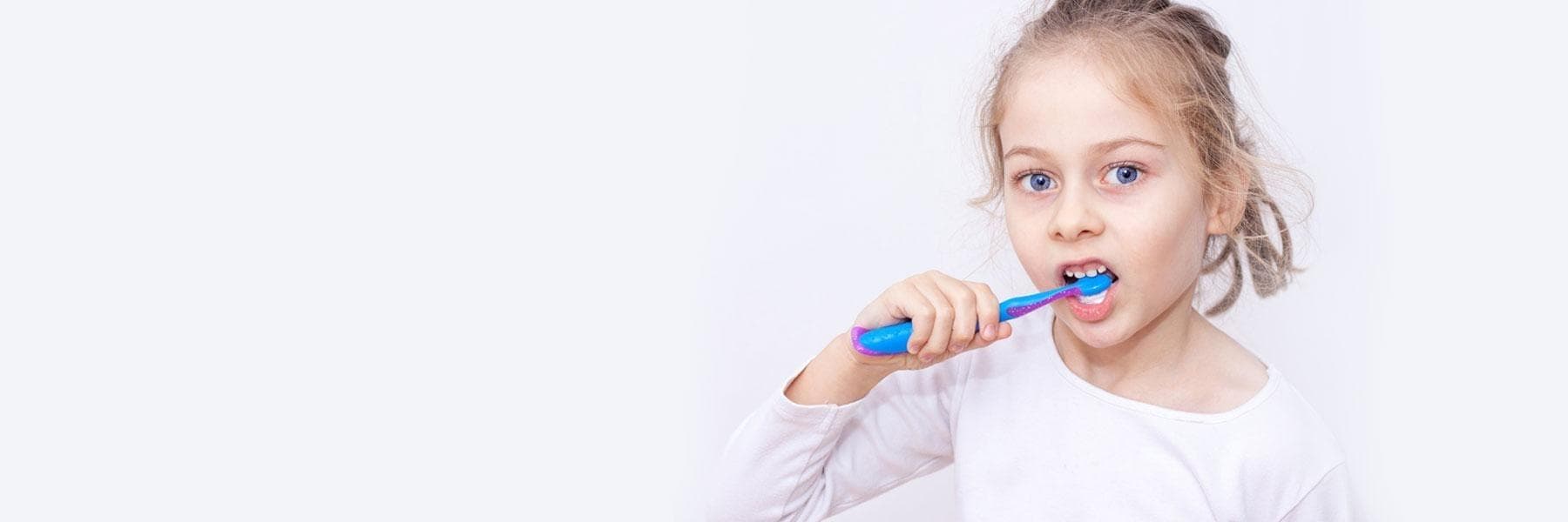 Dentist meticulously crafting a porcelain veneer.
